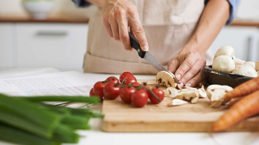 Chef preparing seasonal dish with farm-fresh vegetables