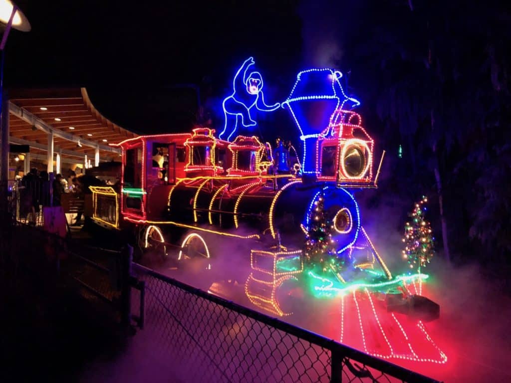 Visitors walking through the dazzling light tunnel during ZooLights Portland 2025